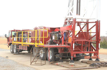 Service King Manufacturing SK 675 Carrier mount rig with 109 foot workover derrick. 